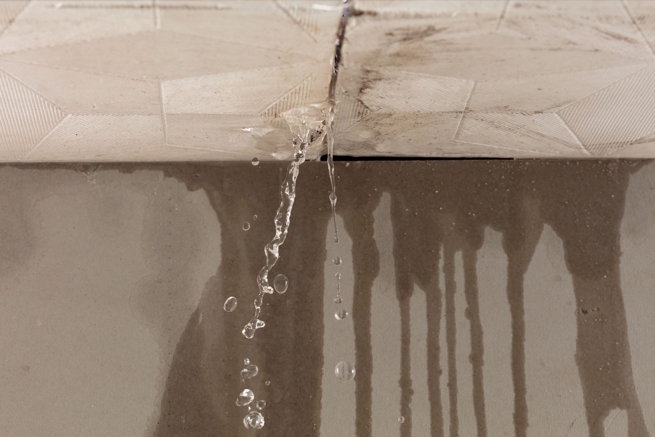 Insurance adjuster meeting with homeowner on-site after water damage